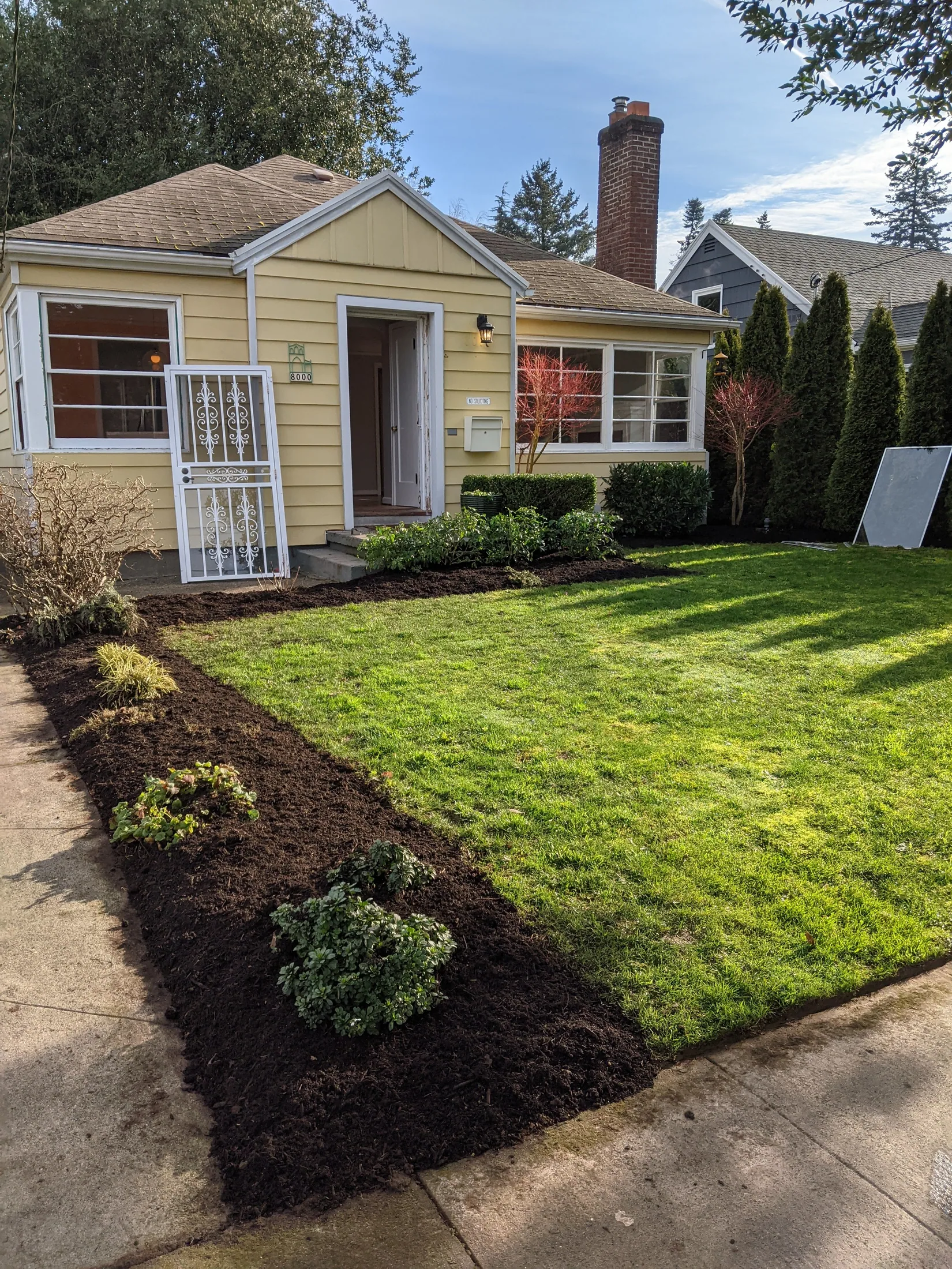 Front yard beds refreshed and fed heading into the fall season